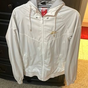 White with gold accent Nike wind breaker